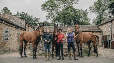Dengie staff posing with Horses
